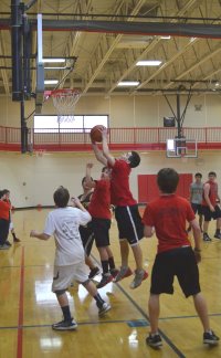 Young man playing basketball during open gym
